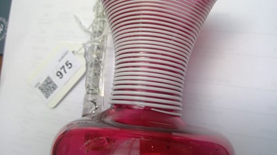 Lot 975 - A Victorian cranberry glass vase with white...