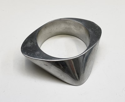 Lot 189 - Four modernist bangles in cast aluminium,...