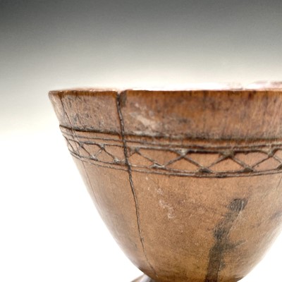 Lot 193 - A 19th century carved hardwood goblet, with a...