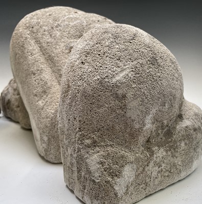 Lot 674 - A carved volcanic rock stylised figure, height...