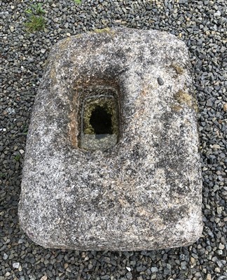 Lot 562 - A granite stone plinth with central hole,...