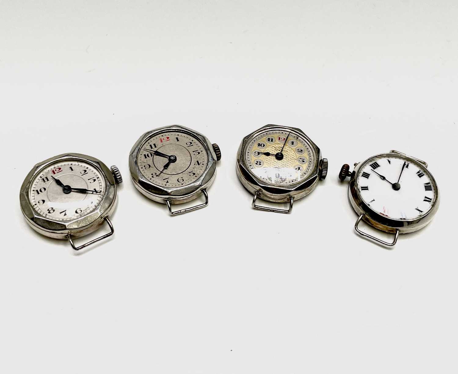 Lot 29 - Four ladies silver cased trench style watches.