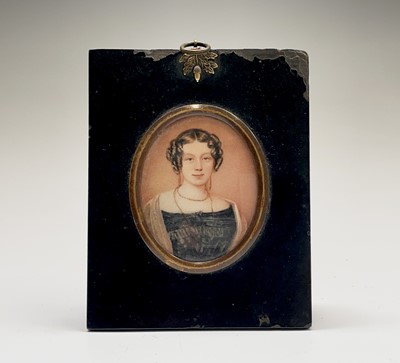 Lot 309 - Miniature portrait of a young lady, her hair...