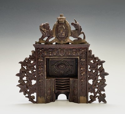 Lot 171 - A Victorian cast iron miniature fireplace,...