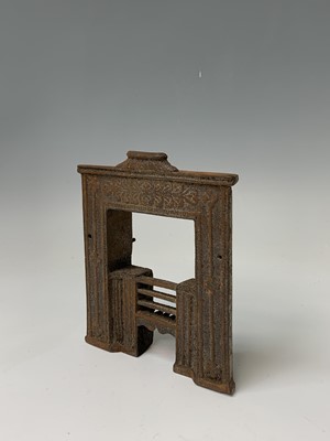 Lot 172 - A Victorian miniature cast iron fireplace,...