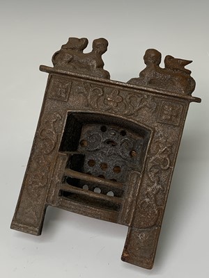 Lot 173 - A Victorian miniature cast iron fireplace,...