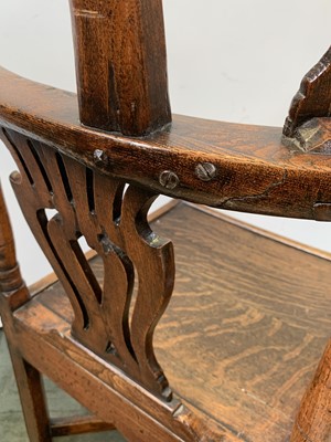 Lot 197 - A George III oak corner armchair, with...