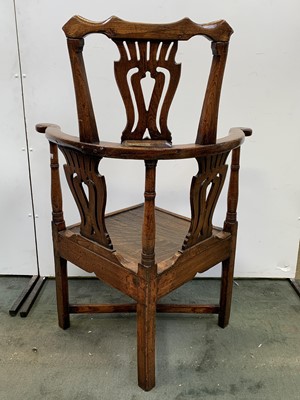 Lot 116 - A George III oak corner armchair, with...