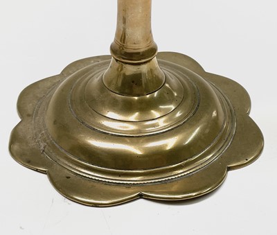 Lot 162 - A pair of George III petal base brass...