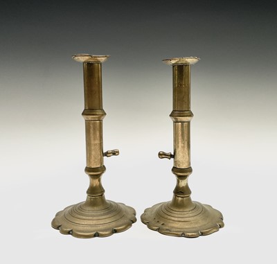 Lot 163 - A near pair of George III brass ejector...