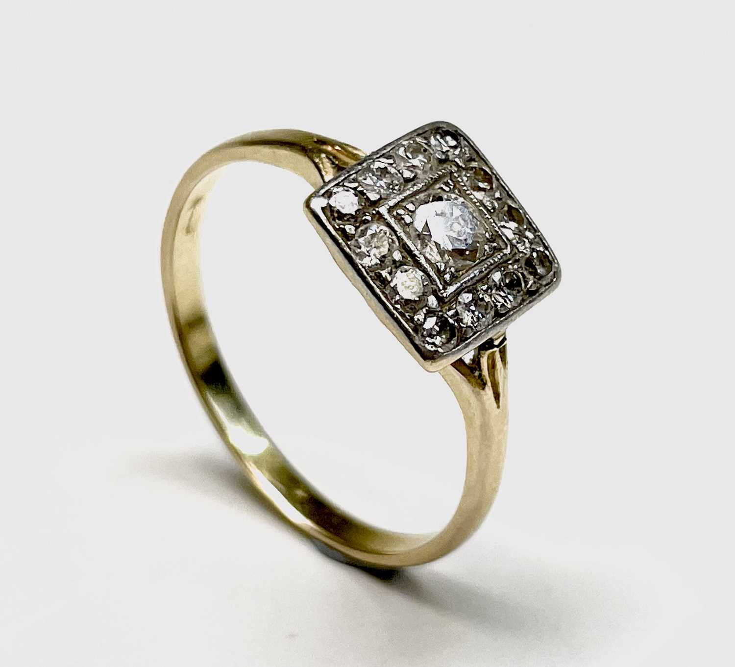 Lot 144 - A prettily-set 18ct gold and diamond ring, the...