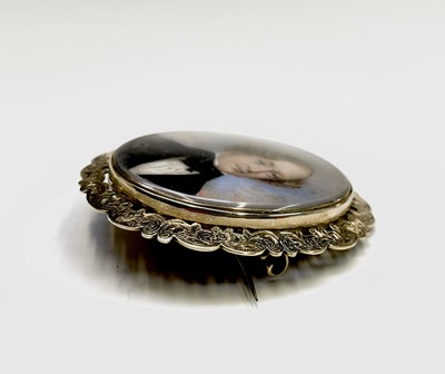 Lot 120 - A Victorian chased gold memoriam brooch set...