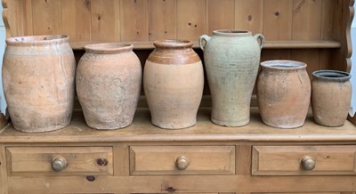 Lot 530 - A group of six terracotta storage jars,...