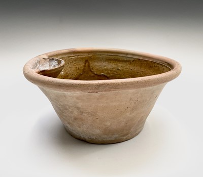 Lot 529 - A terracotta farming pan, with glazed interior...