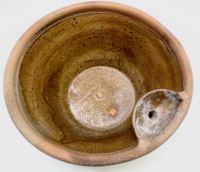 Lot 529 - A terracotta farming pan, with glazed interior...