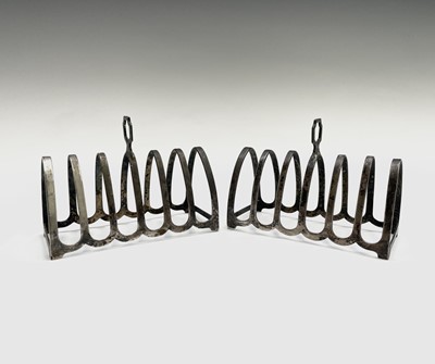 Lot 385 - A pair of silver toast racks by Henry Clifford...