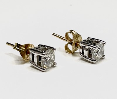 Lot 118 - A pair of diamond stud earrings each stone of...