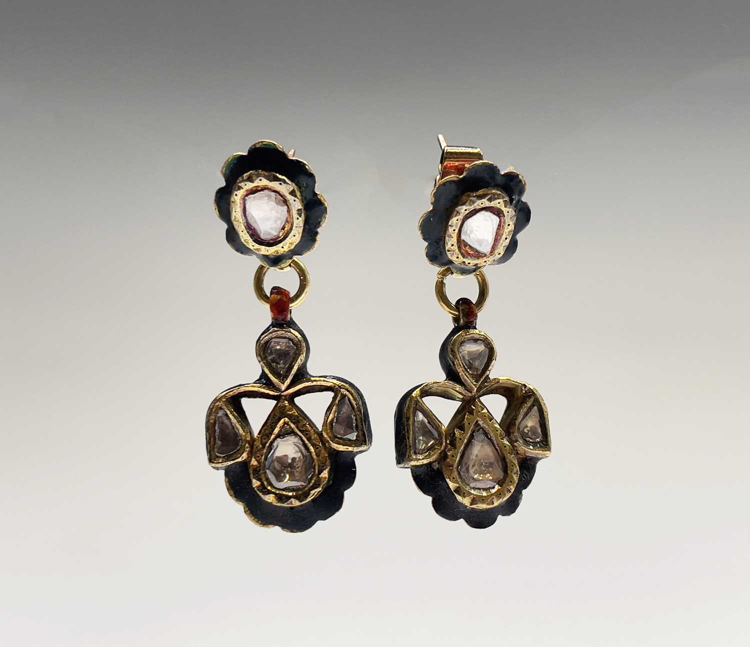 Lot 50 - A pair of Indian gold enamel and diamond set...