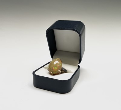 Lot 112 - An impressive opal ring with diamond set...