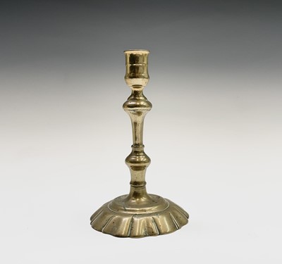 Lot 106 - Six George III petal base brass candlesticks,...
