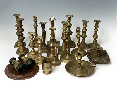 Lot 127 - Four pairs of brass candlesticks, 18th and...