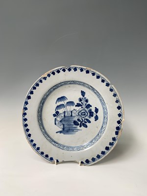 Lot 107 - An English delft dish, circa 1760, painted in...