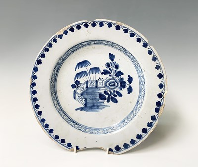 Lot 107 - An English delft dish, circa 1760, painted in...