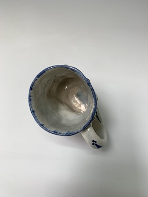 Lot 110 - An English pearlware satyr jug, early 19th...