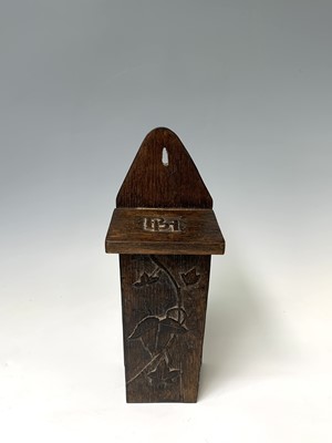 Lot 203 - An oak candle box, circa 1900, with rustic...