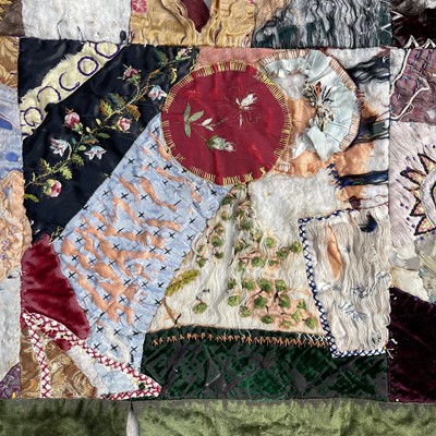 Lot 397 - A unusual patchwork quilt, circa 1920's,...