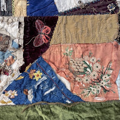 Lot 83 - A unusual patchwork quilt, circa 1920's,...
