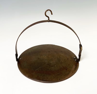 Lot 201 - A Kenrick hanging iron cooking skillet, also...