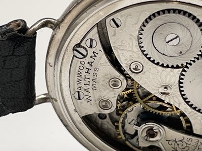 Lot 8 - A Waltham silver trench cased wristwatch the...