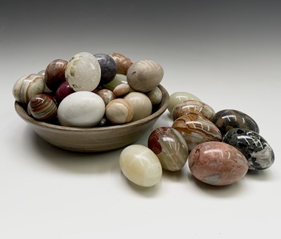 Lot 179 - A large collection of carved hardstone eggs....