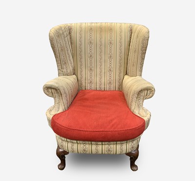 Lot 217 - A walnut upholstered wing armchair, circa 1800,...