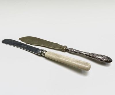 Lot 429 - An engraved silver butter knife with ivory...