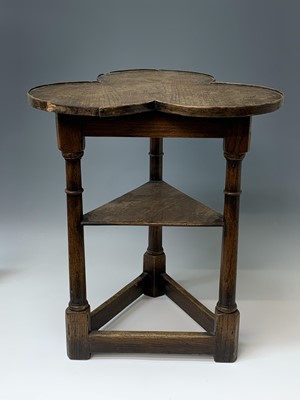 Lot 243 - An oak cricket table, 20th century, the lobed...