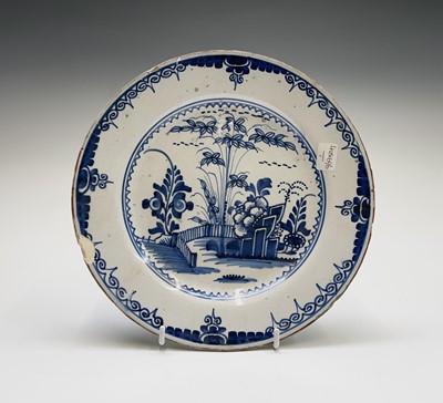 Lot 255 - An English Delft plate, mid 18th century,...