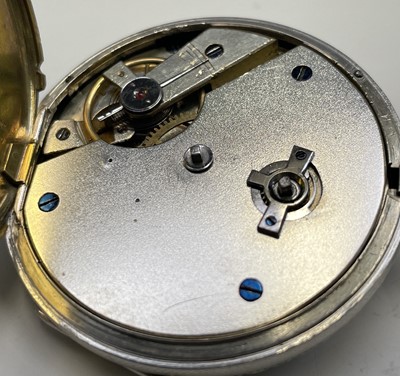 Lot 98 - A silver key-wind pocket watch with ornate...
