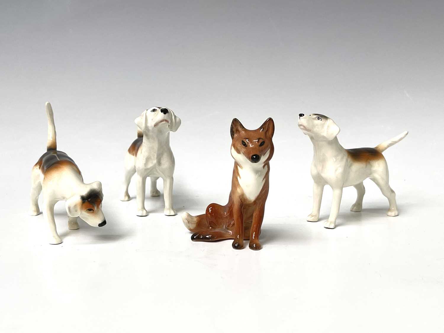 Lot 857 - Three Beswick foxhounds and a Beswick seated...