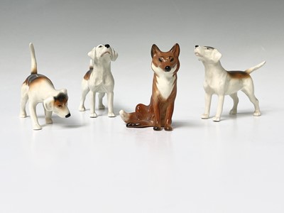 Lot 857 - Three Beswick foxhounds and a Beswick seated...