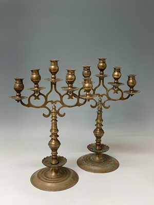 Lot 300 - A pair of Gothic style bronze candelabra,...