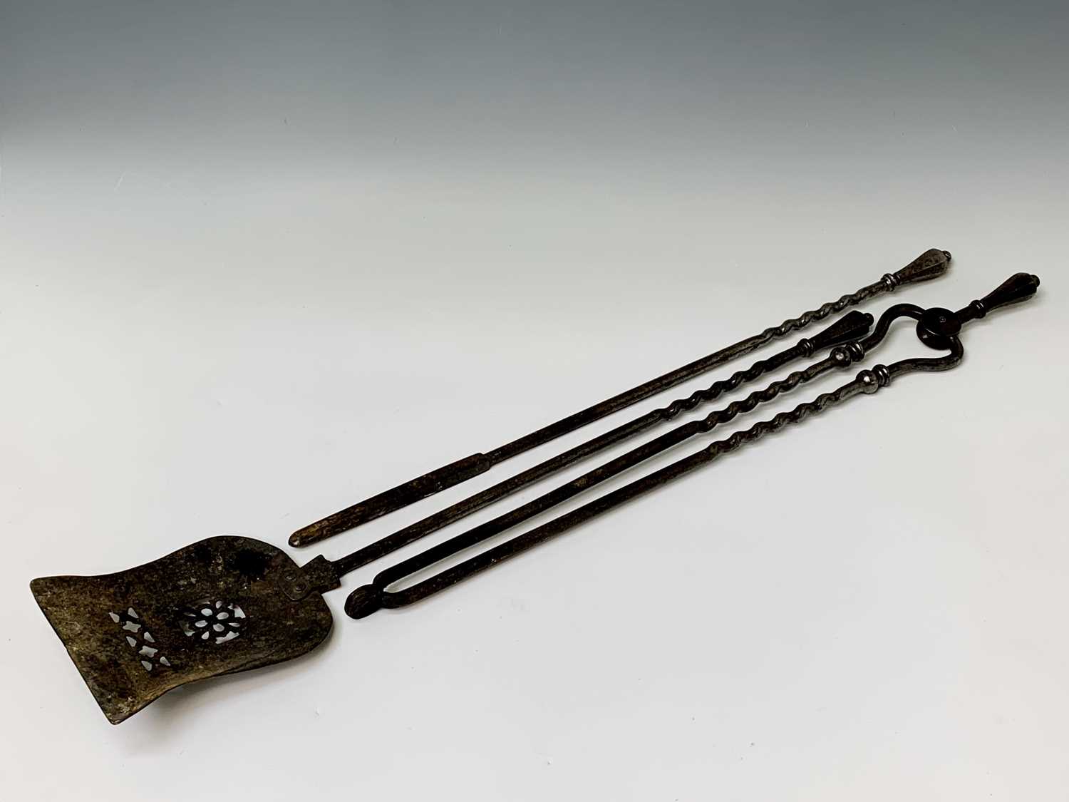 Lot 307 - A set of three steel fire irons, 19th century,...