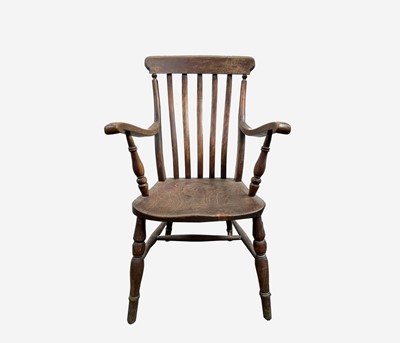 Lot 286 - A Victorian beech and elm lathe back armchair,...