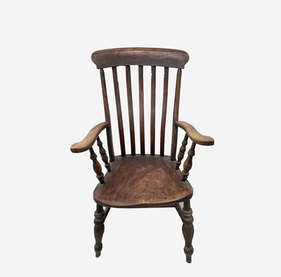 Lot 287 - A Victorian beech and elm lathe back armchair,...