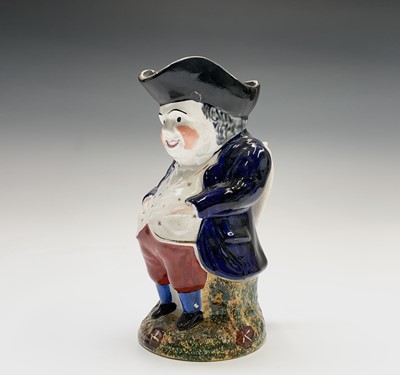 Lot 289 - A Staffordshire pottery Toby jug, late 19th...