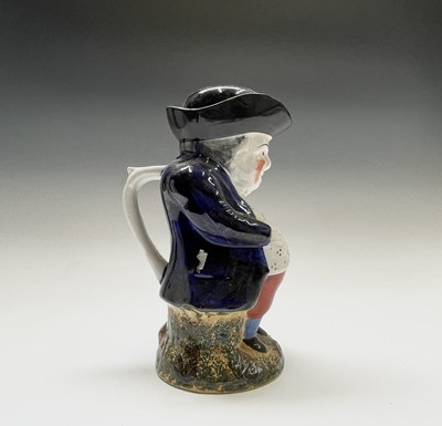 Lot 290 - A Staffordshire pottery Toby jug, early 19th...