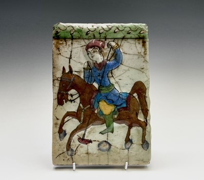 Lot 1055 - A Persian pottery tile, 19th century,...