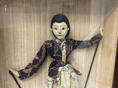 Lot 376 - An Indonesian doll, in a mahogany glazed...