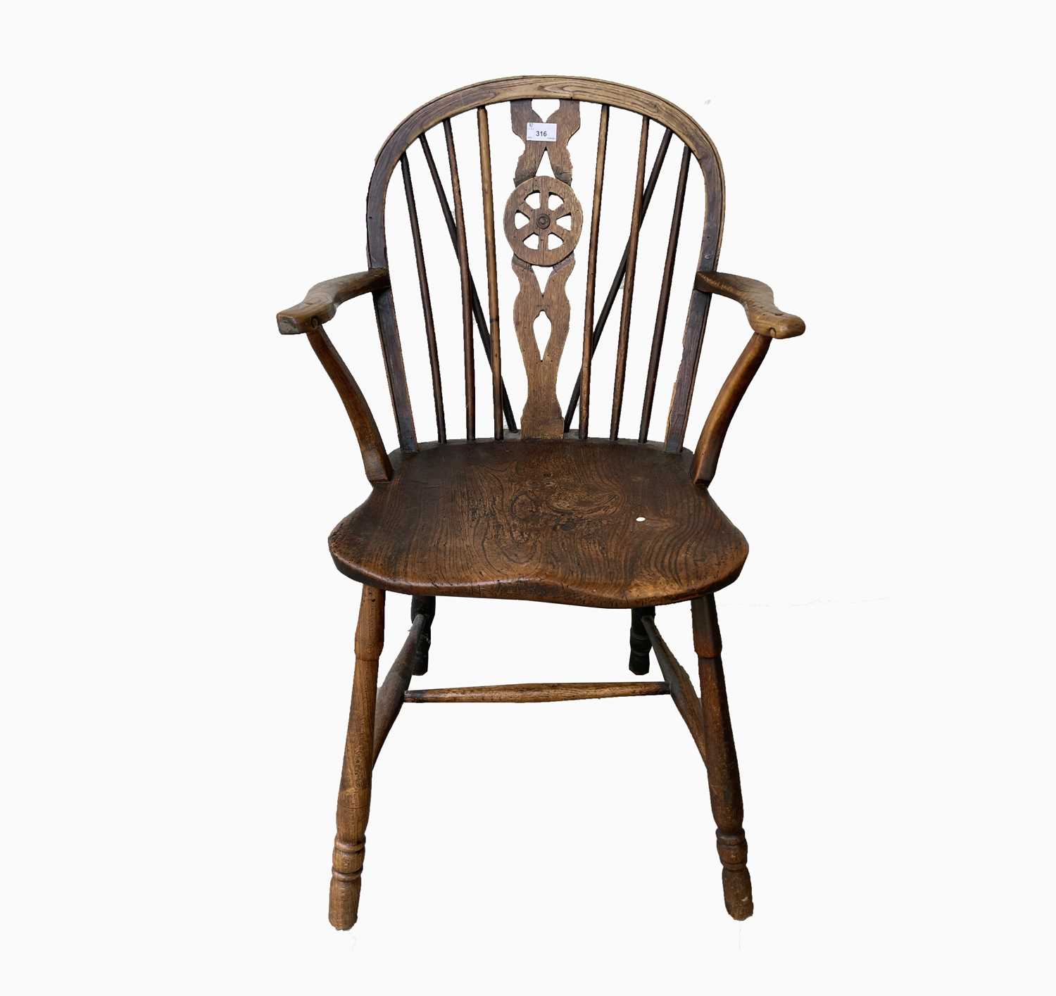 Lot 316 - A Victorian elm wheelback Windsor chair,